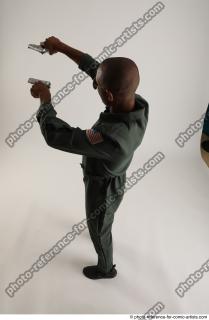 22 2018 01 ERIC STANDING POSE WITH GUNS